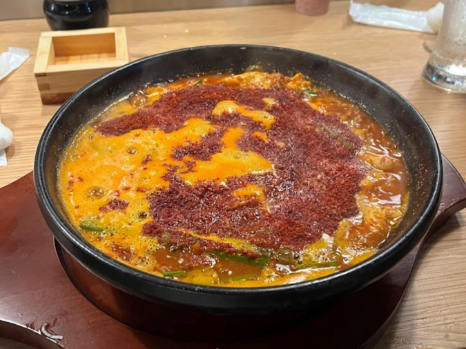 Sake and Kushi Ototto, the final dish of the steamed dumplings is the spicy noodles