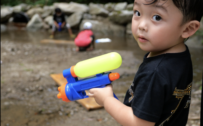 Mountain Garden - Image of playing in the river