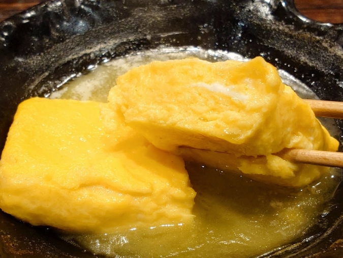 大衆炉端 こめろまん。博多駅総本店　鶏白湯だし巻き➁